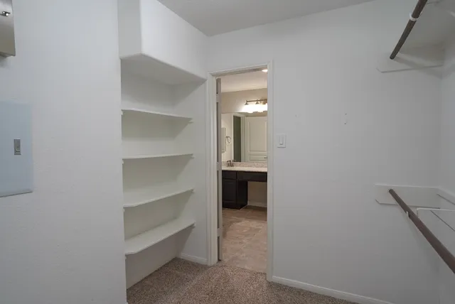 a bathroom with a sink a mirror and vanity