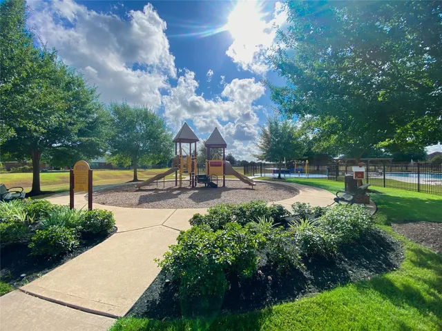a view of a swimming pool and an outdoor seating