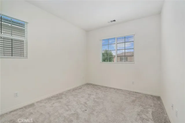 an empty room with closet area