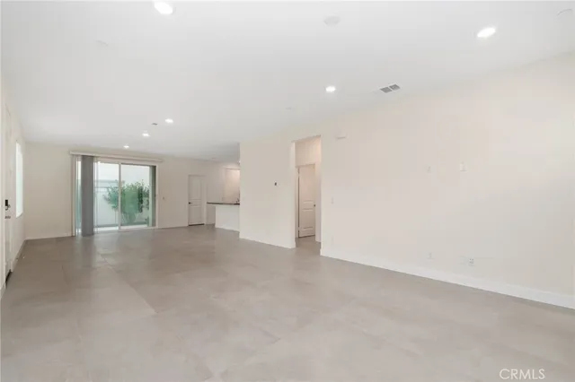 an empty room with windows and mountain view