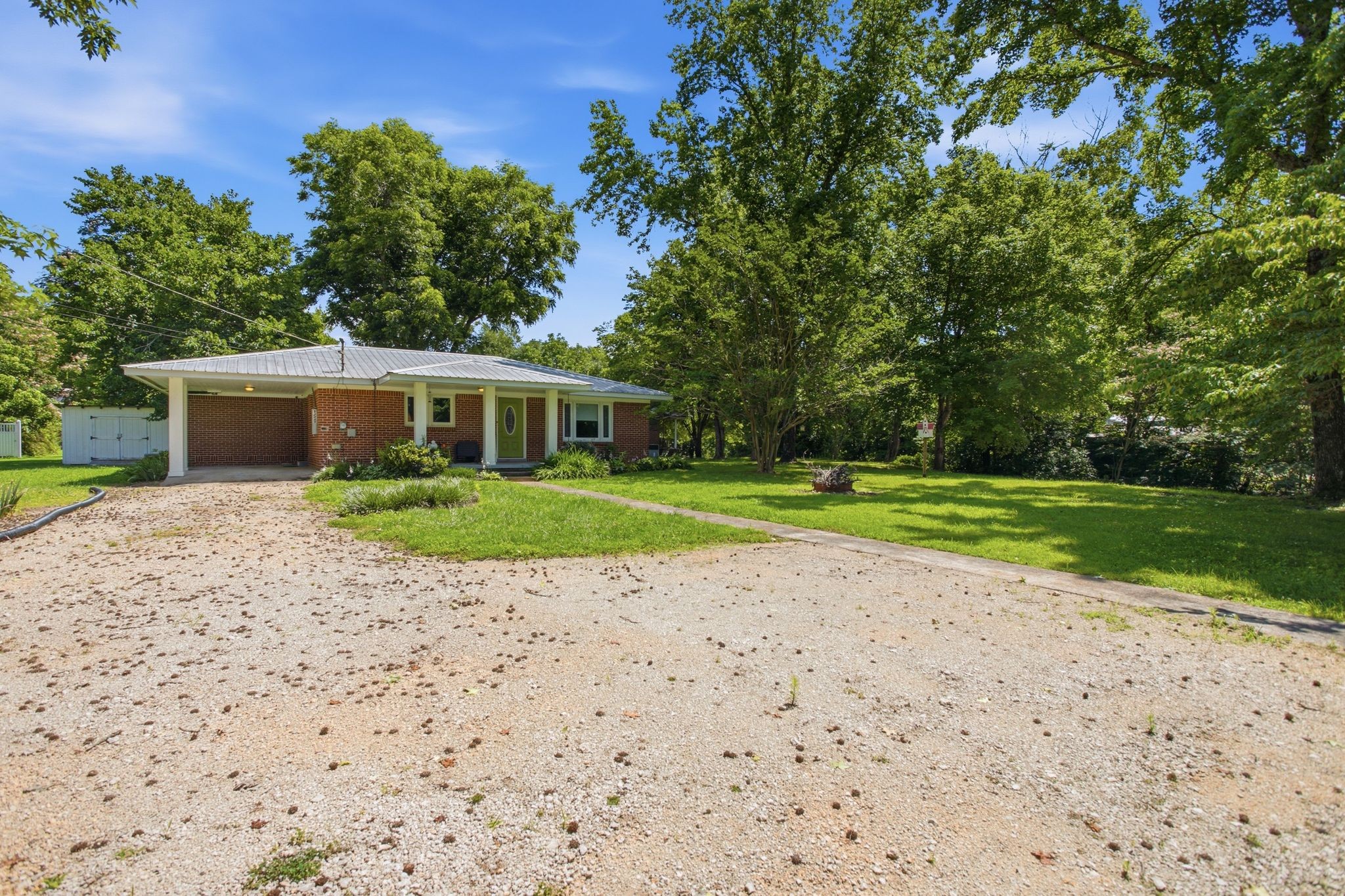 150 Toms Creek Road Linden, TN 37096 - Photo 18 of 23 a view of a house with a yard