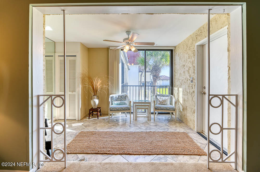 2321 Costa Verde Boulevard, Unit 201 Jacksonville Beach, FL 32250 - Photo 15 of 33 a view of a livingroom with furniture and window
