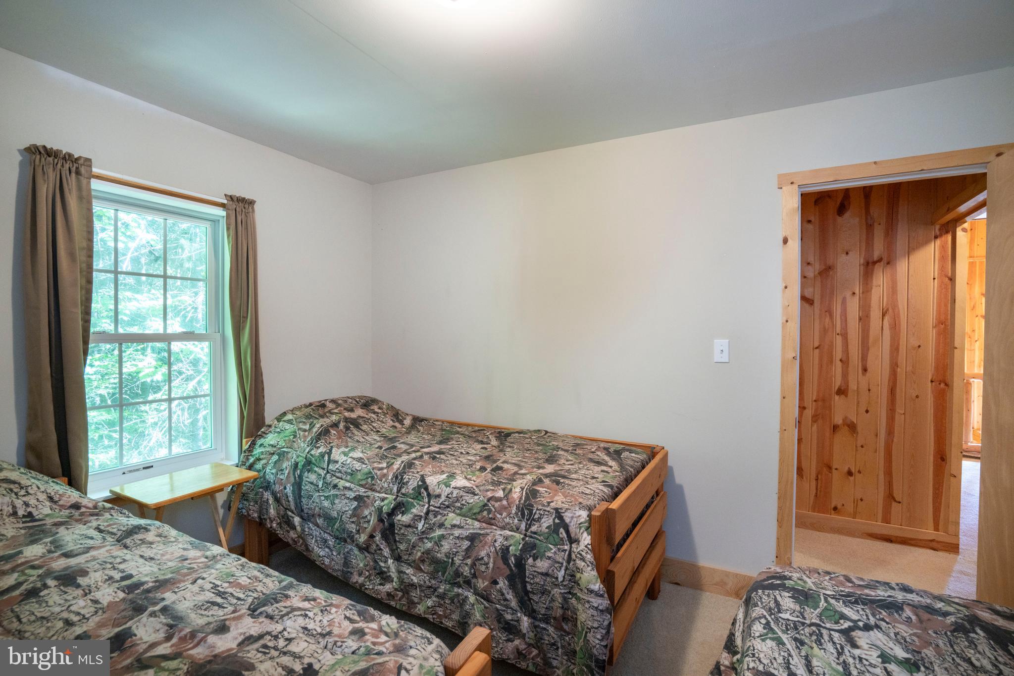 385 Elk Creek Road Aaronsburg, PA 16820 - Photo 48 of 71 a bedroom with a bed and a window