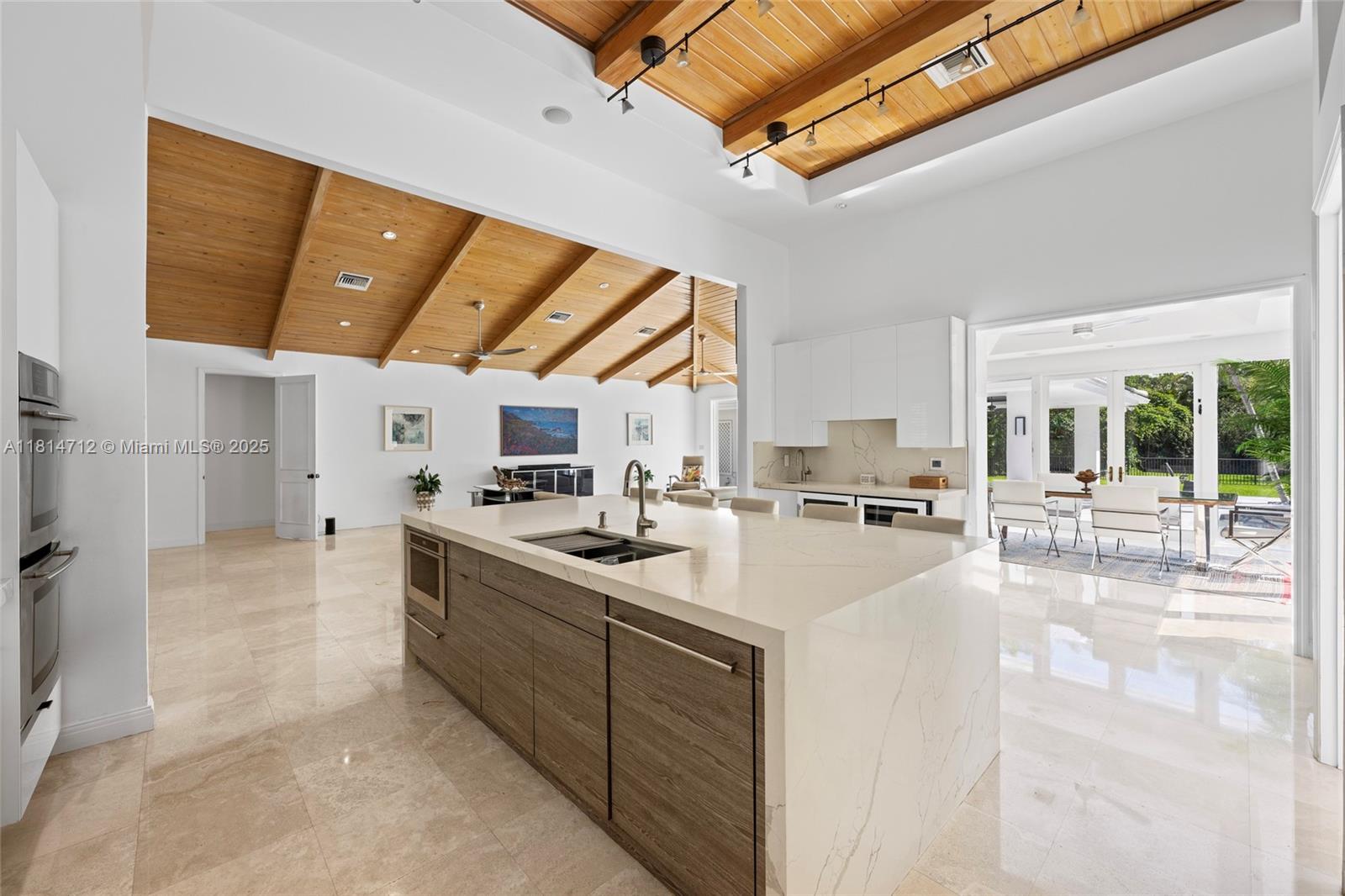 2805 Hackney Road Weston, FL 33331 - Photo 13 of 39 a large white kitchen with a large window and stainless steel appliances