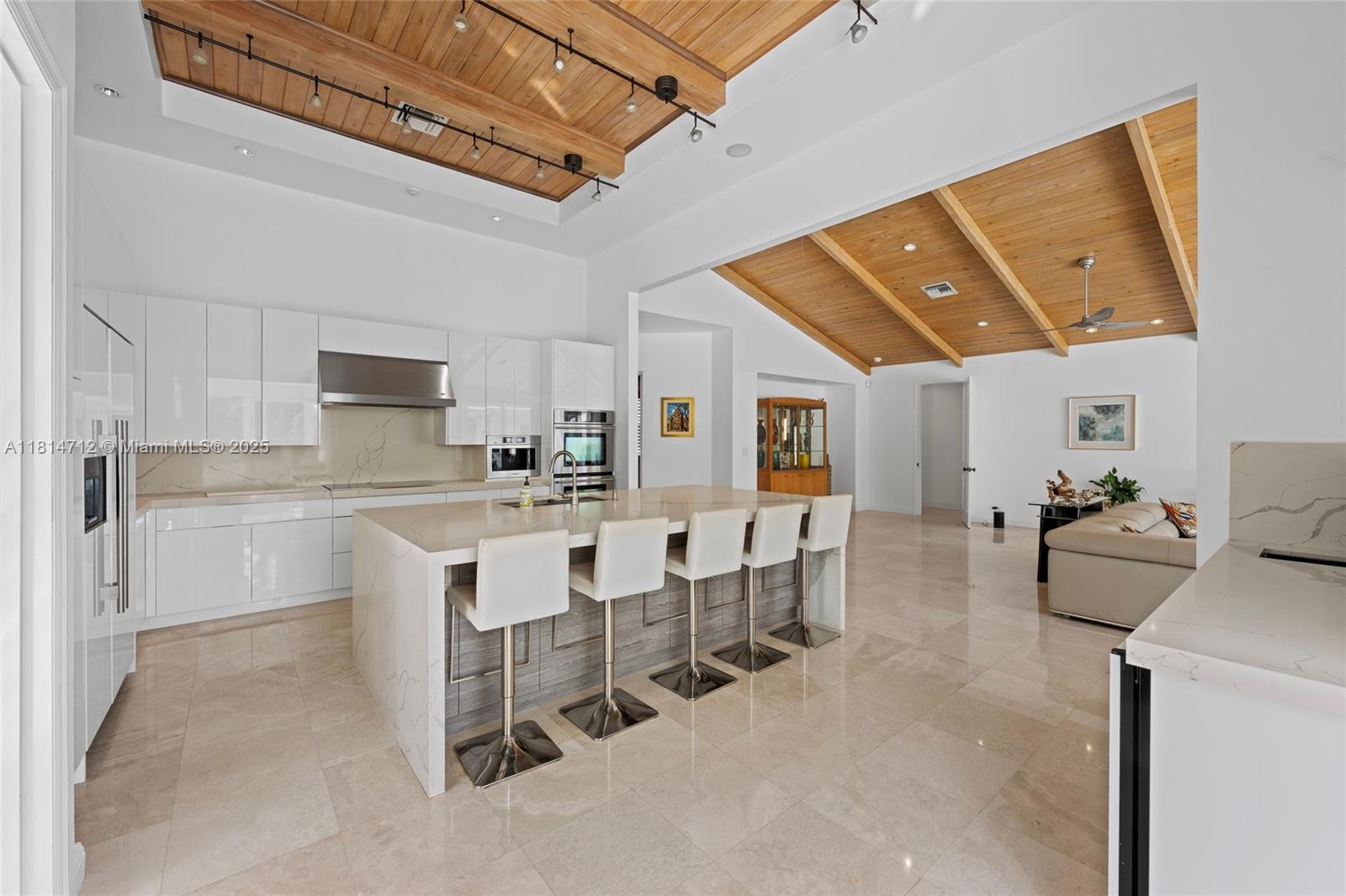 2805 Hackney Road Weston, FL 33331 - Photo 14 of 39 a large white kitchen with a large window and stainless steel appliances