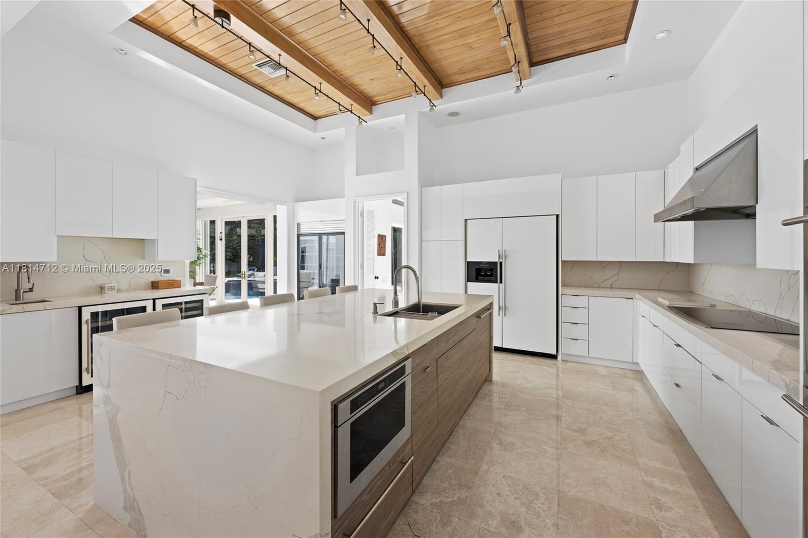 2805 Hackney Road Weston, FL 33331 - Photo 15 of 39 a large white kitchen with stainless steel appliances granite countertop a sink and cabinets