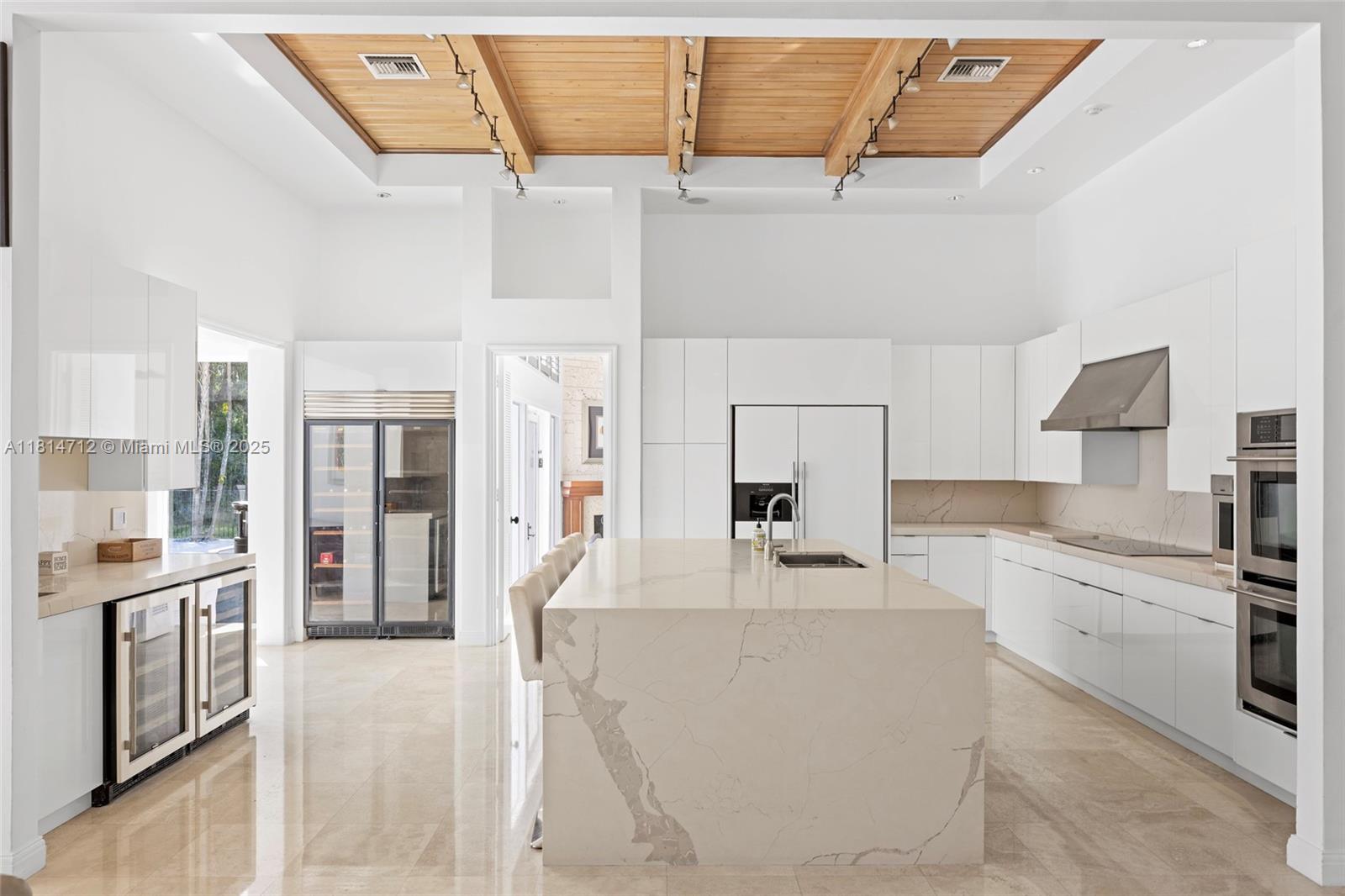 2805 Hackney Road Weston, FL 33331 - Photo 16 of 39 a large white kitchen with cabinets