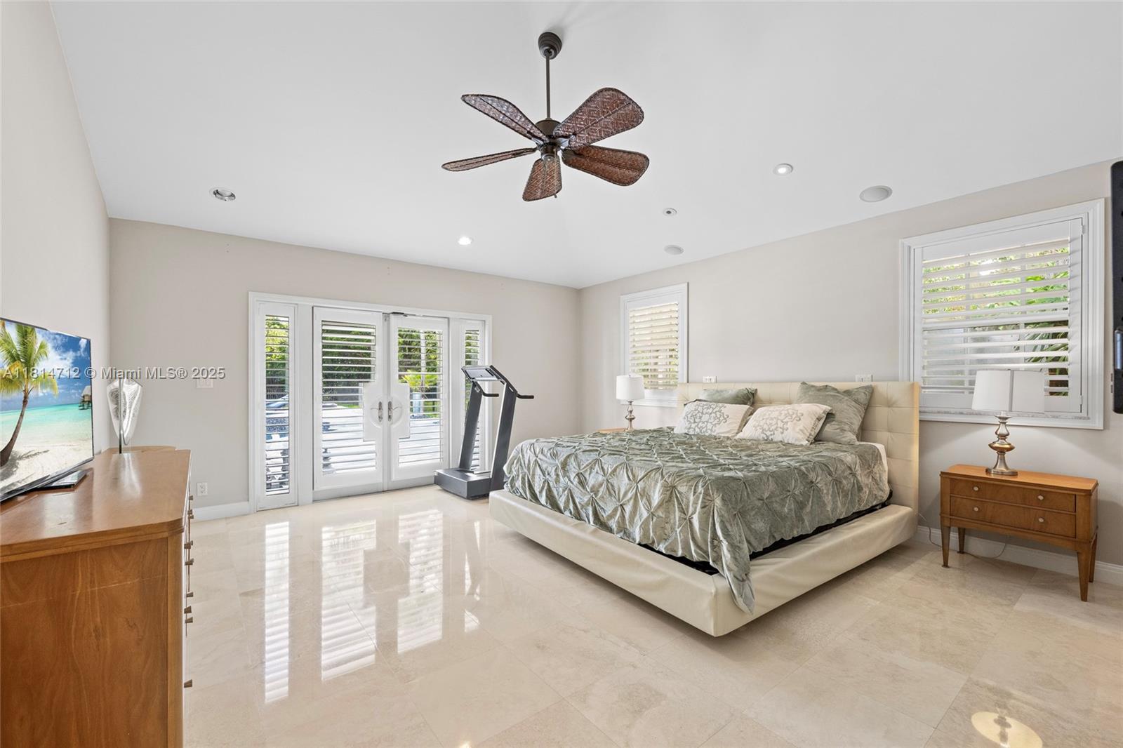 2805 Hackney Road Weston, FL 33331 - Photo 17 of 39 a living room with a bed furniture and a large window