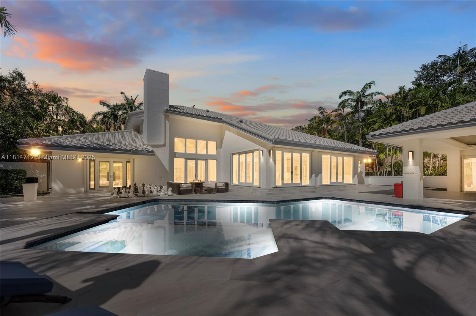 2805 Hackney Road Weston, FL 33331 - Photo 2 of 39 a view of a swimming pool with outdoor seating