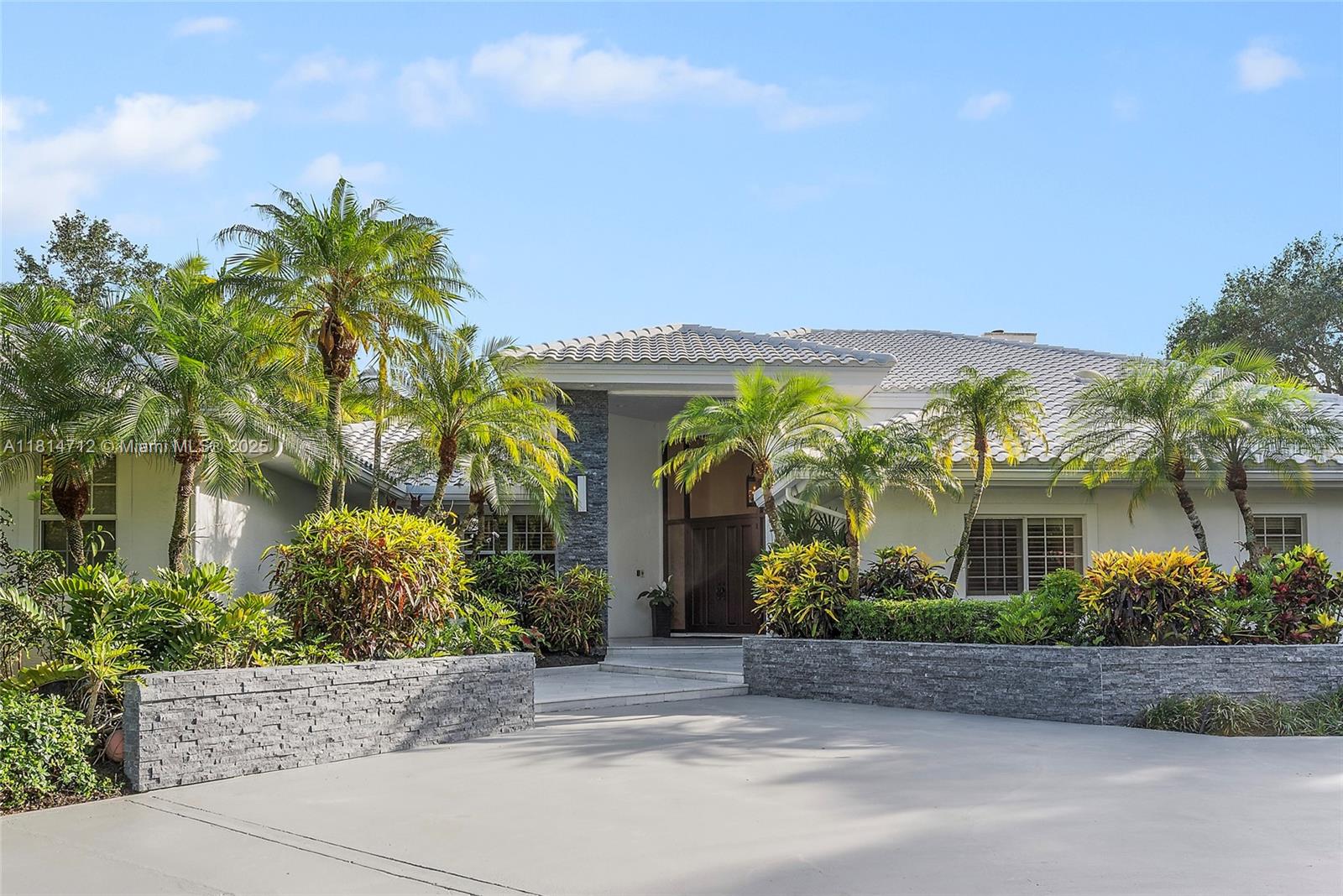 2805 Hackney Road Weston, FL 33331 - Photo 21 of 39 front view of a house with potted plants