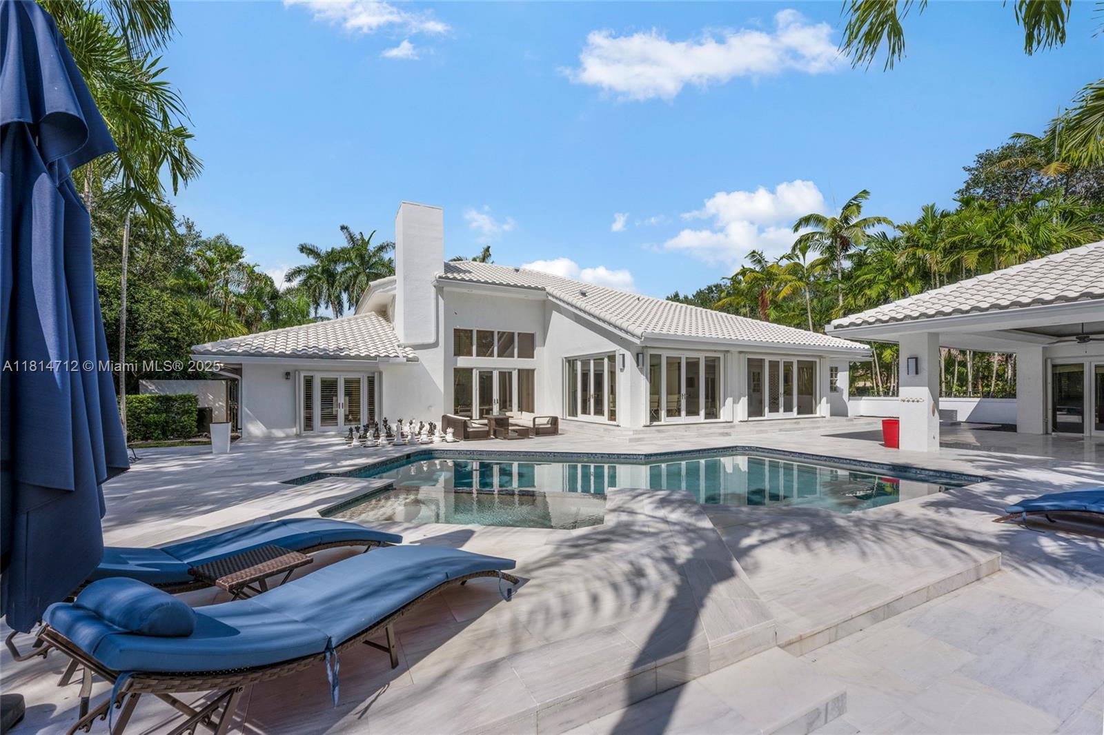 2805 Hackney Road Weston, FL 33331 - Photo 27 of 39 a front view of a house with yard and balcony