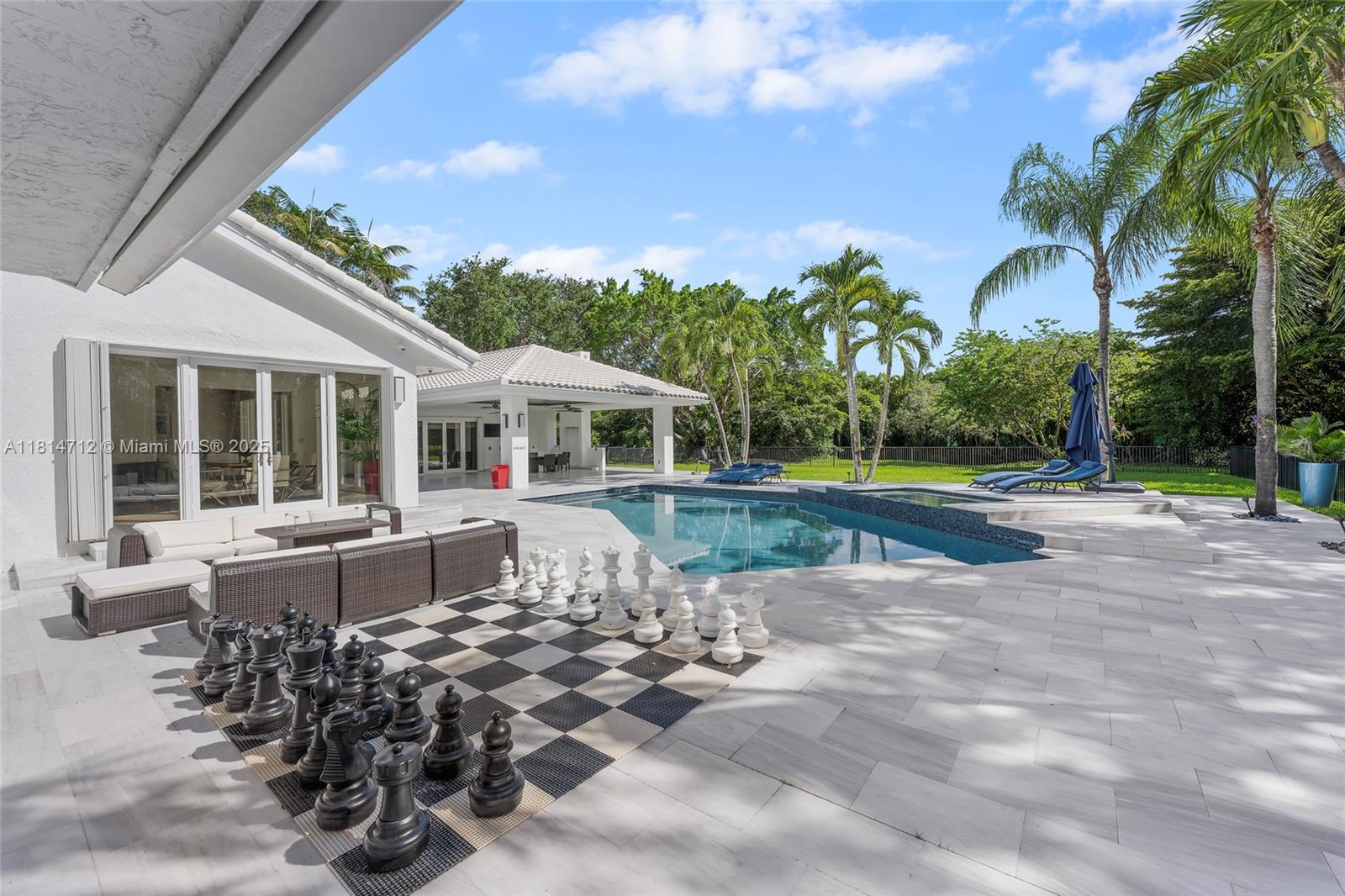 2805 Hackney Road Weston, FL 33331 - Photo 28 of 39 a view of a house with backyard and sitting area
