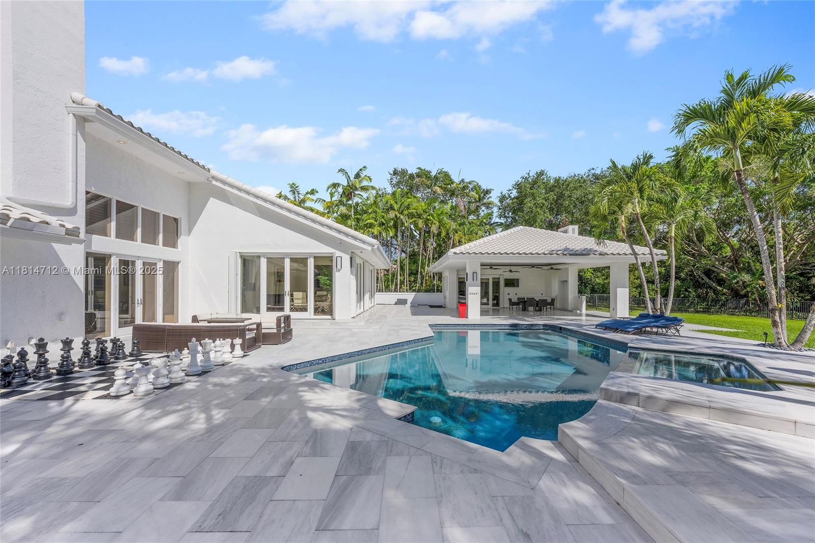 2805 Hackney Road Weston, FL 33331 - Photo 29 of 39 a view of a house with backyard and sitting area