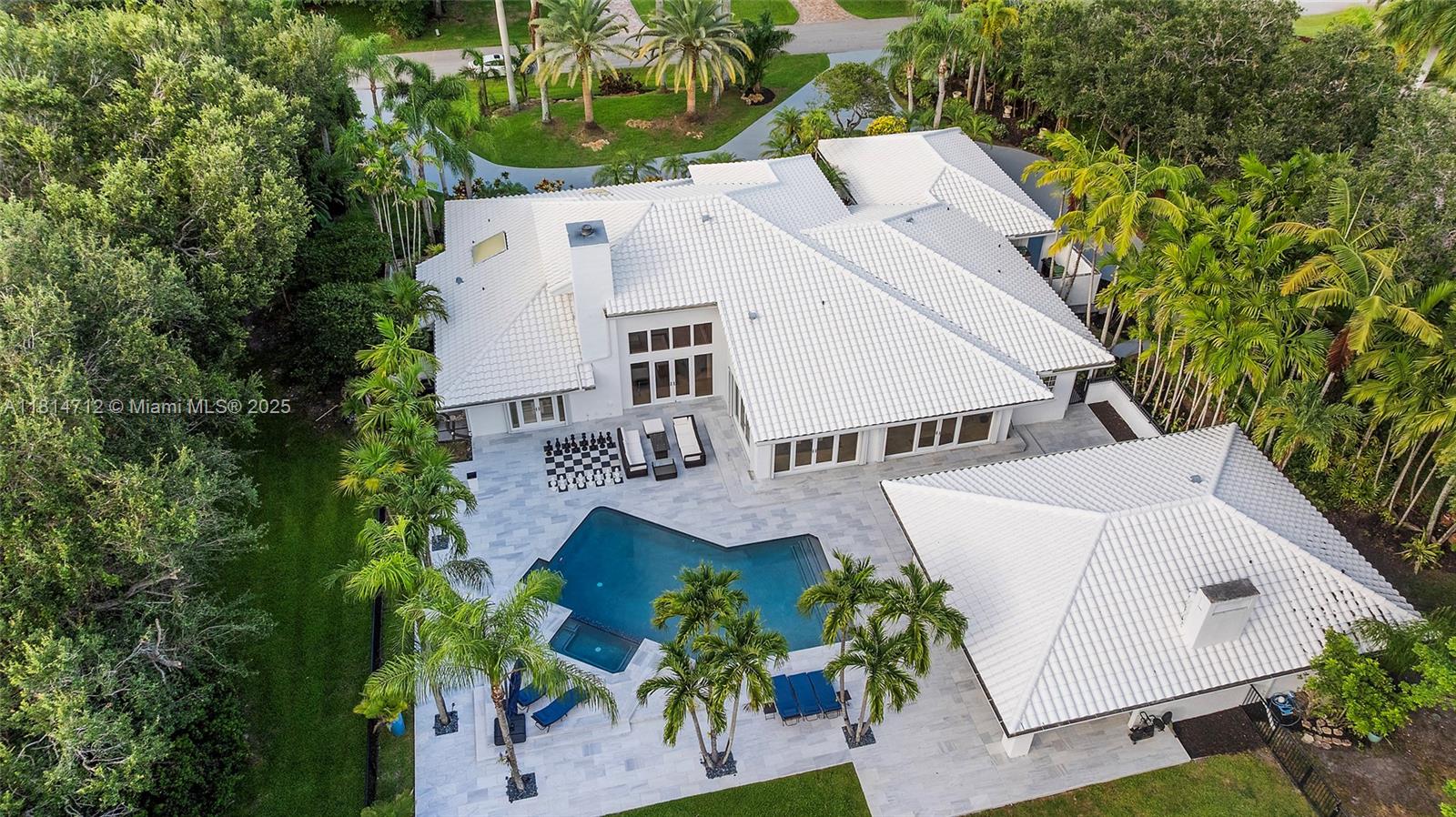 2805 Hackney Road Weston, FL 33331 - Photo 34 of 39 an aerial view of a house with a yard and trees