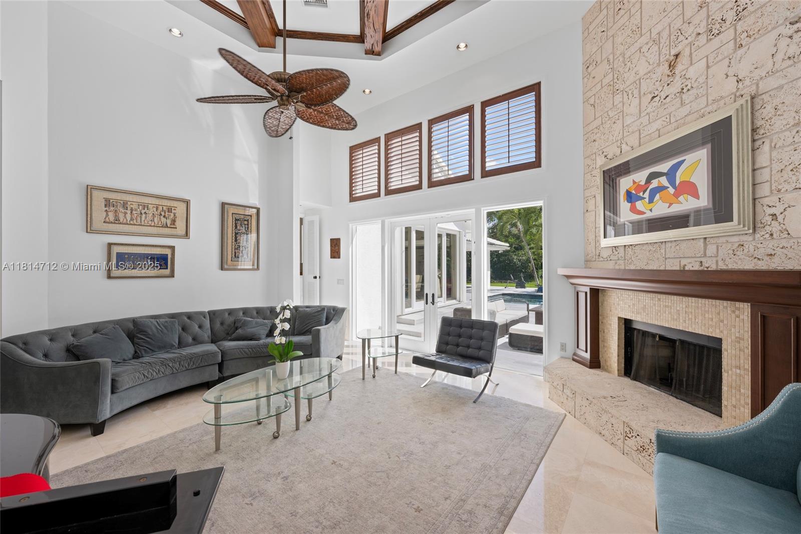 2805 Hackney Road Weston, FL 33331 - Photo 7 of 39 a living room with furniture a fireplace and a flat screen tv