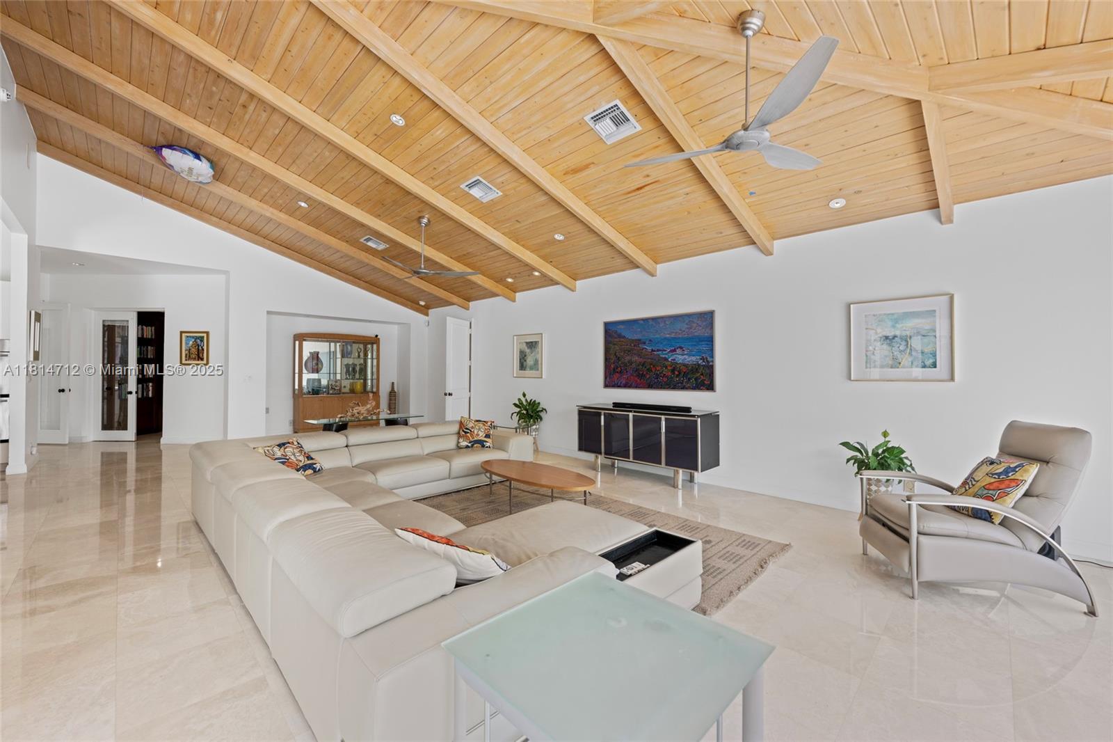 2805 Hackney Road Weston, FL 33331 - Photo 9 of 39 a living room with furniture and a flat screen tv