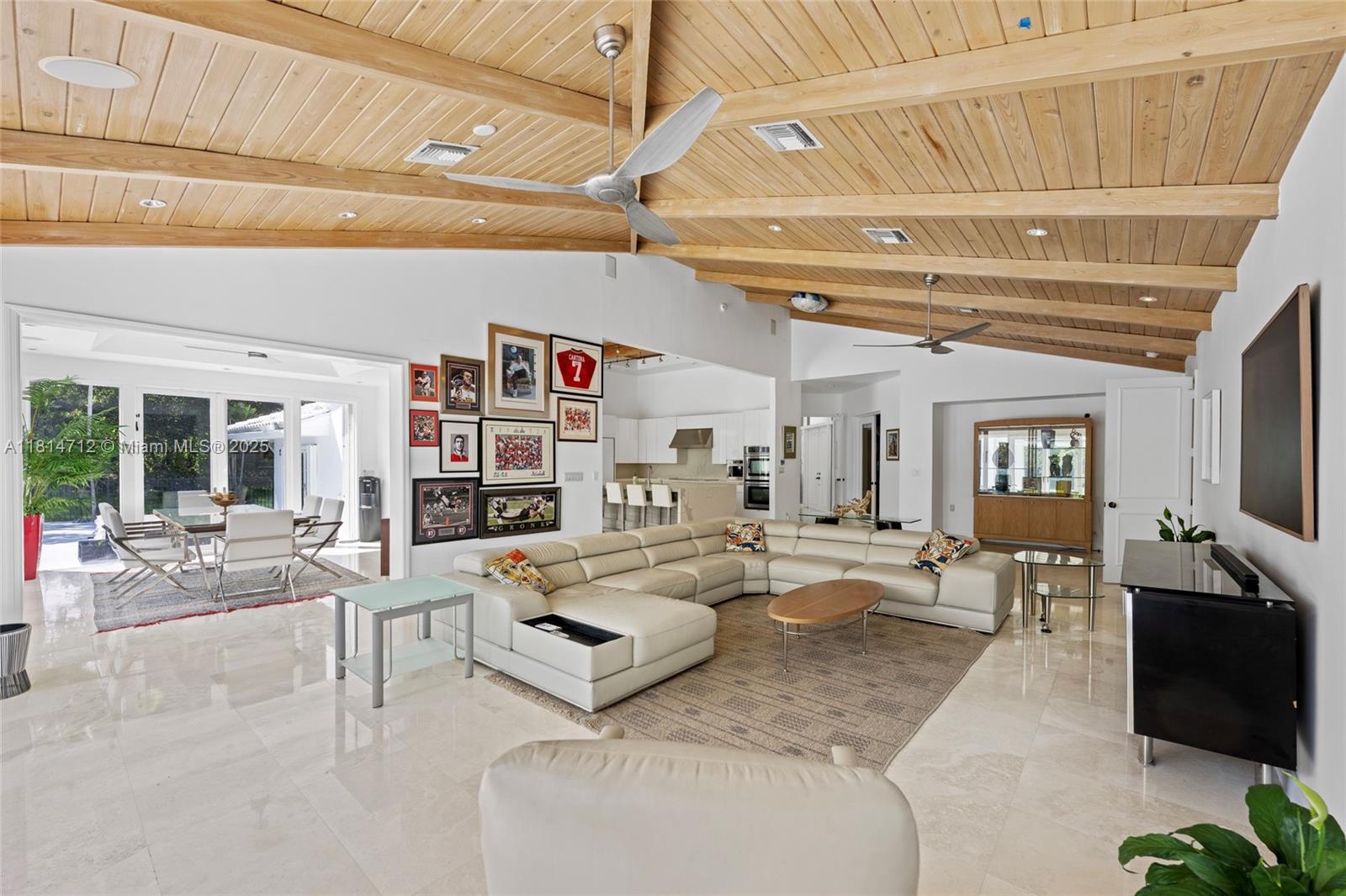 2805 Hackney Road Weston, FL 33331 - Photo 10 of 39 a living room with furniture and a flat screen tv
