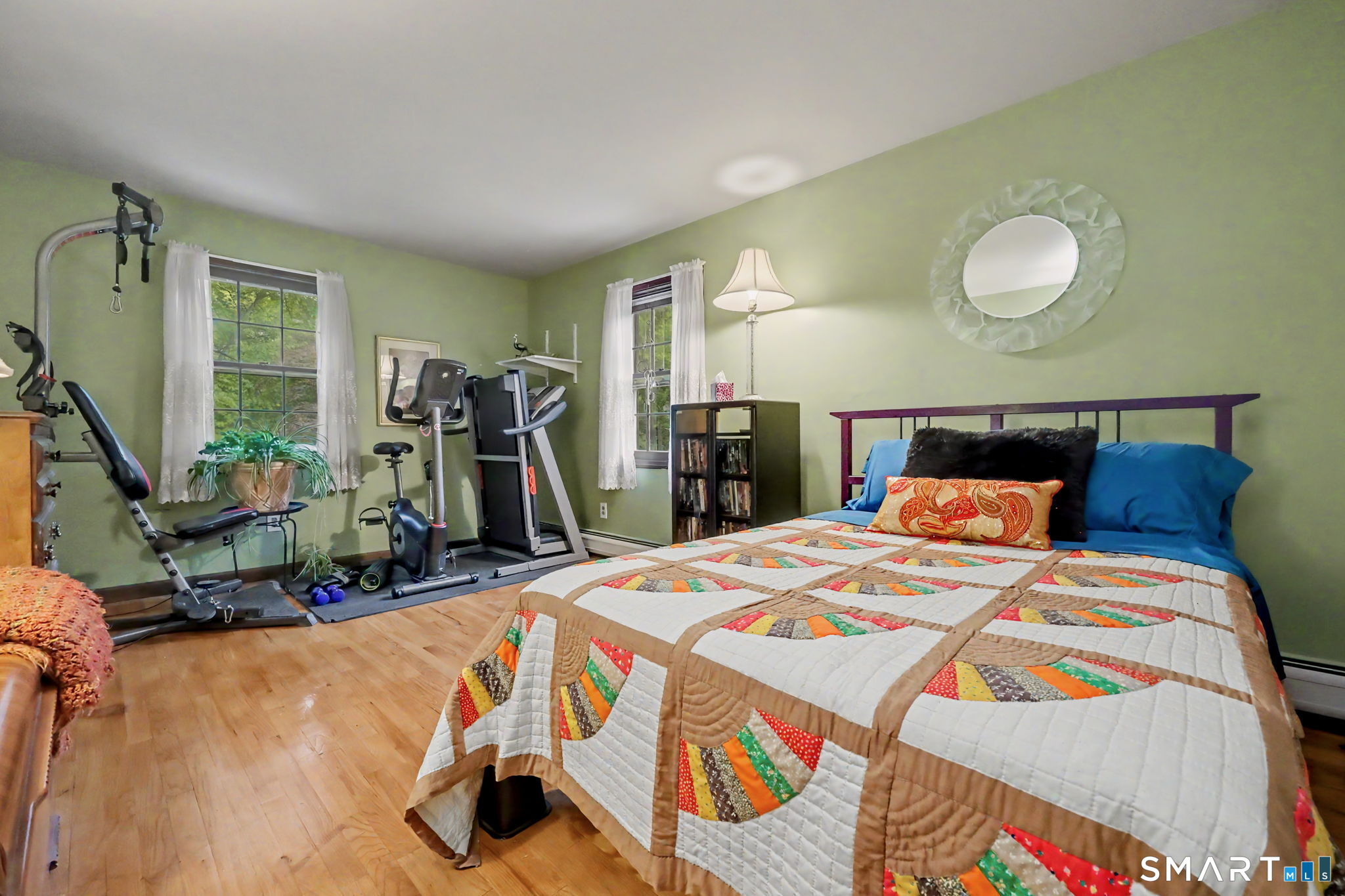 571 Wheeler Road Monroe, CT 06468 - Photo 18 of 40 a bedroom with bed and a mirror
