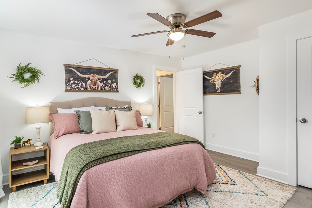 587 Oak Trace East Jasper, GA 30143 - Photo 11 of 47 a bedroom with a large bed and a chandelier