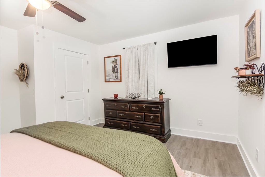 587 Oak Trace East Jasper, GA 30143 - Photo 12 of 47 a bedroom with a bed and a flat screen tv