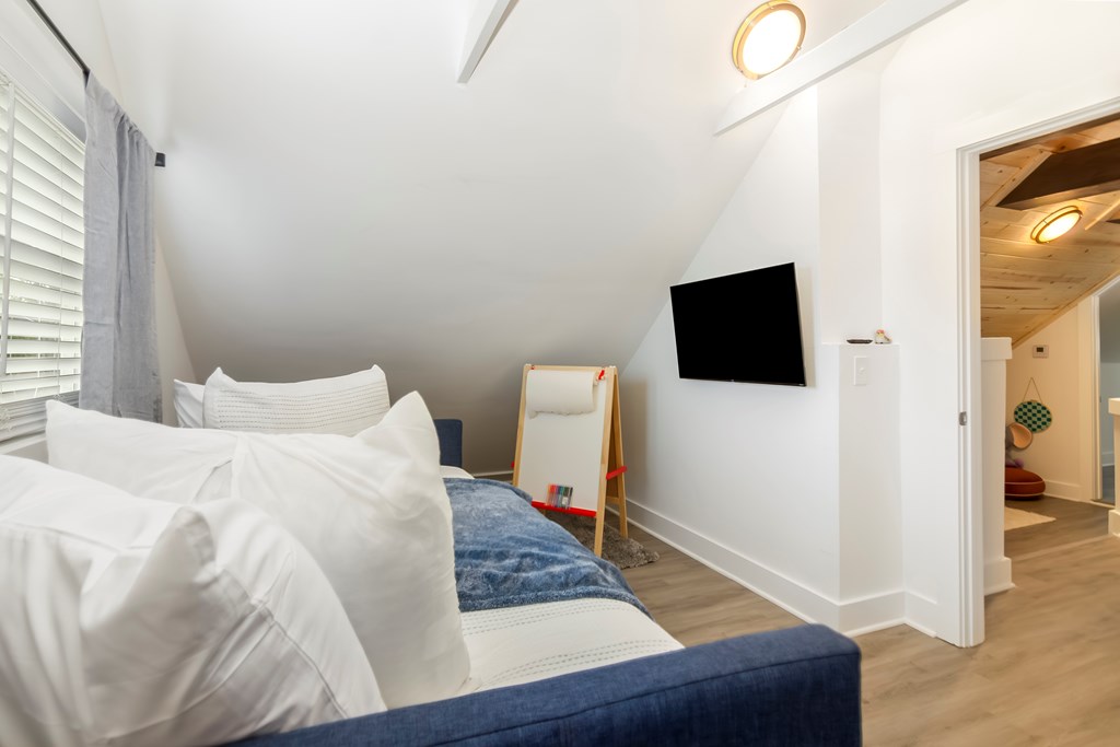 587 Oak Trace East Jasper, GA 30143 - Photo 26 of 47 a bedroom with a bed and a flat screen tv