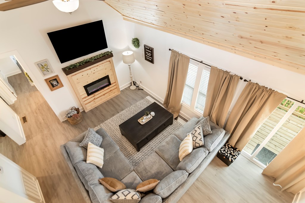 587 Oak Trace East Jasper, GA 30143 - Photo 28 of 47 a living room with furniture and a flat screen tv