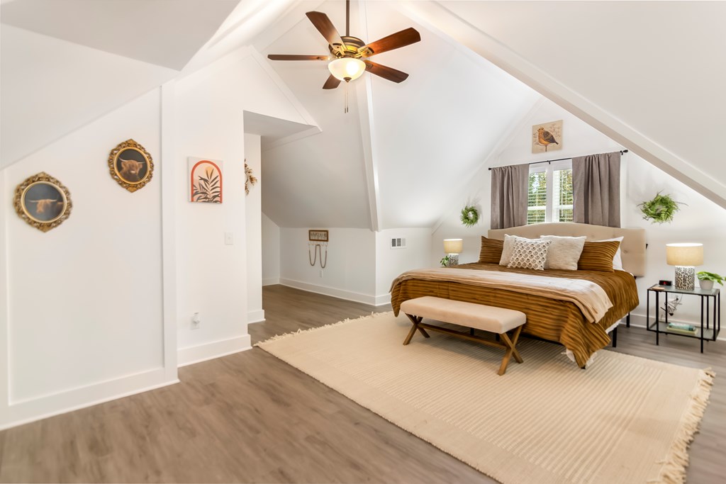 587 Oak Trace East Jasper, GA 30143 - Photo 34 of 47 a bedroom with a bed and a chandelier