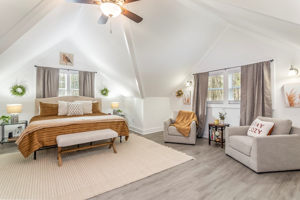 587 Oak Trace East Jasper, GA 30143 - Photo 35 of 47 a spacious bedroom with a bed and a couch