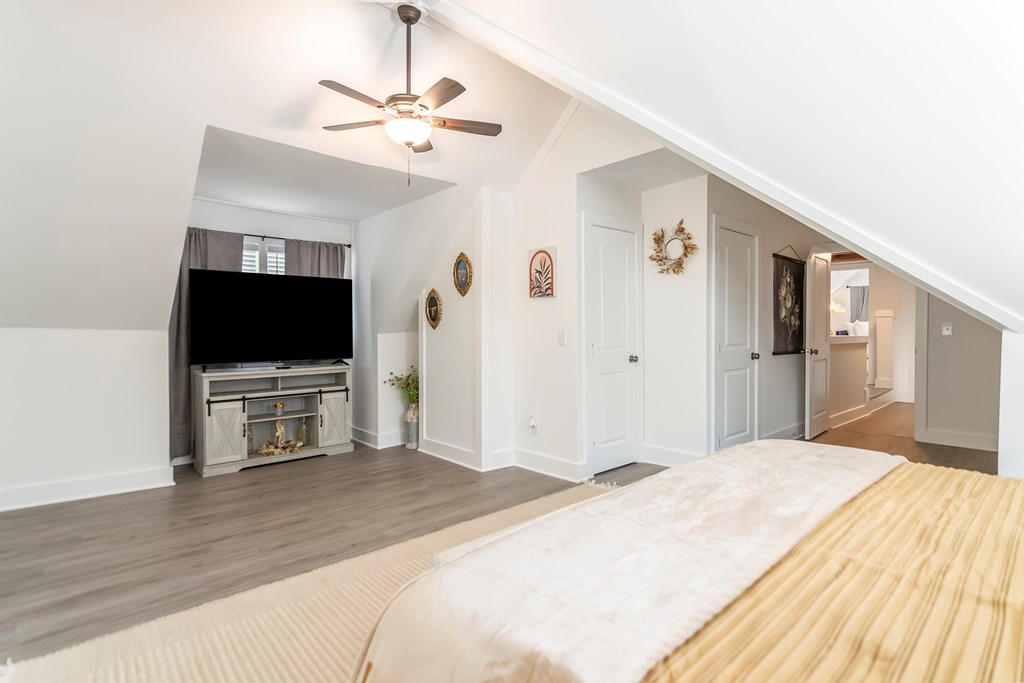 587 Oak Trace East Jasper, GA 30143 - Photo 36 of 47 a bedroom with a bed and a flat screen tv