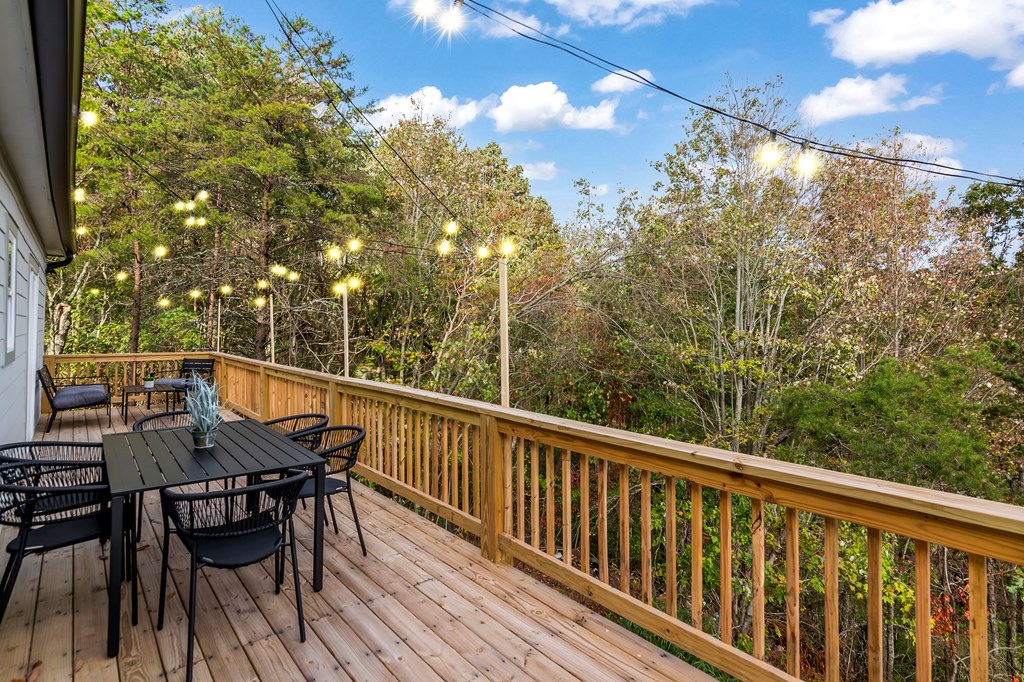 587 Oak Trace East Jasper, GA 30143 - Photo 37 of 47 a view of a balcony with furniture and wooden floor