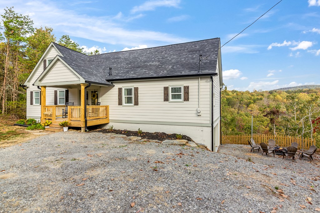 587 Oak Trace East Jasper, GA 30143 - Photo 40 of 47 a view of a house with a yard