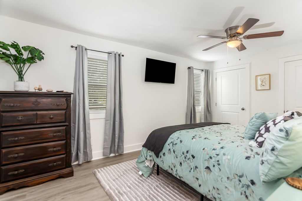 587 Oak Trace East Jasper, GA 30143 - Photo 7 of 47 a bedroom with a bed and a chandelier