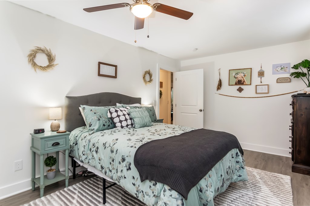 587 Oak Trace East Jasper, GA 30143 - Photo 8 of 47 a bedroom with a bed and painting on the wall