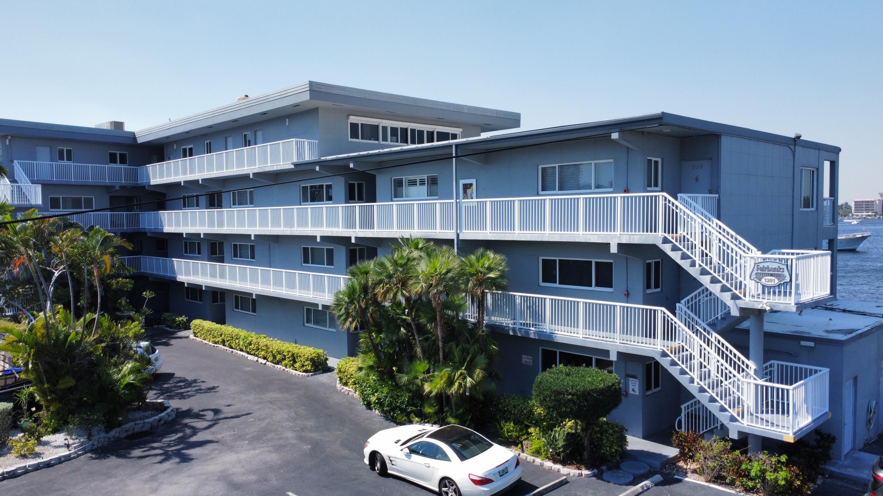 1201 South Riverside Drive, Unit 106 Pompano Beach, FL 33062 - Photo 17 of 28 a front view of a building with garden
