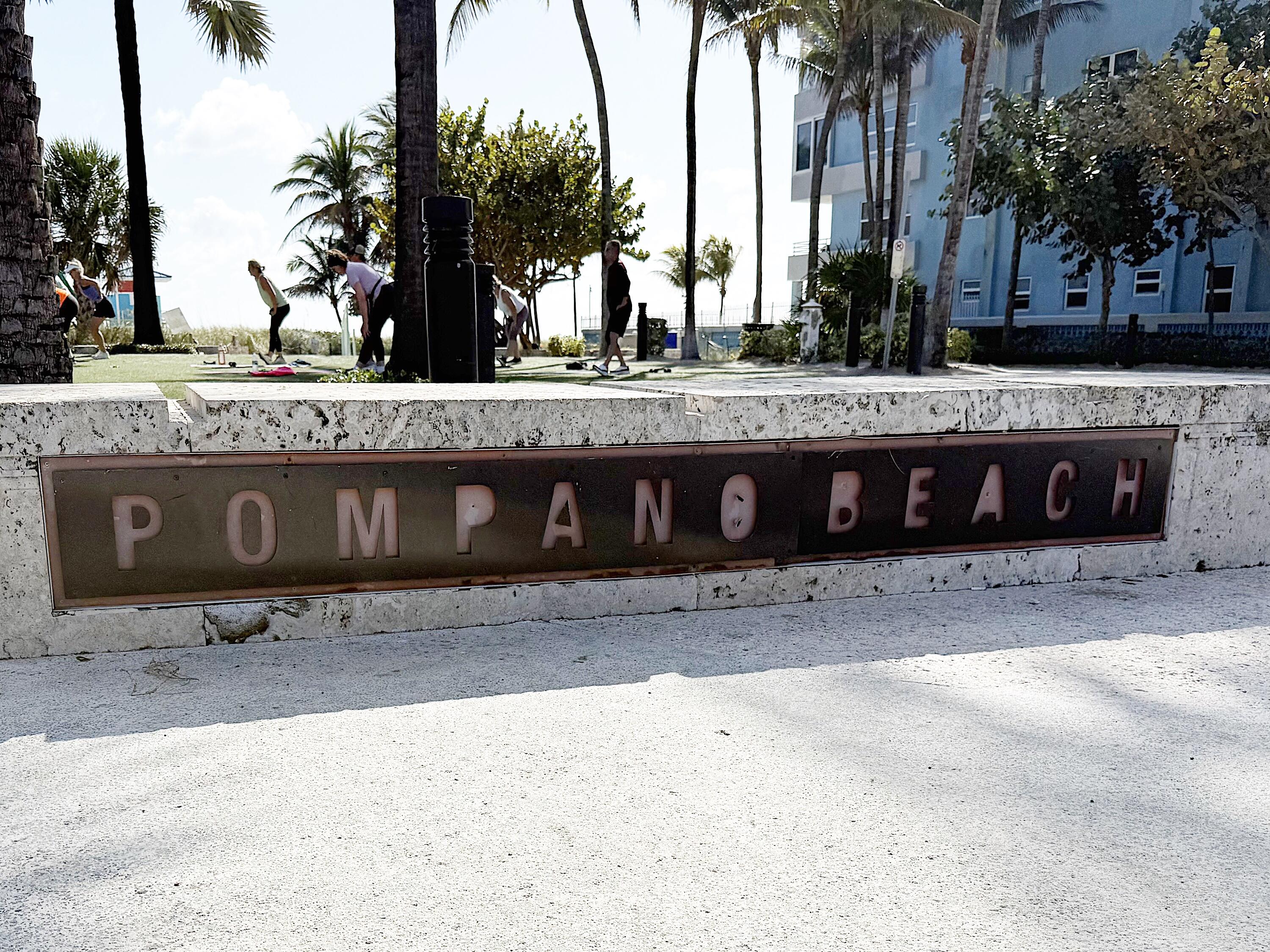 1201 South Riverside Drive, Unit 106 Pompano Beach, FL 33062 - Photo 24 of 28 a view of a backyard with a tub and palm trees