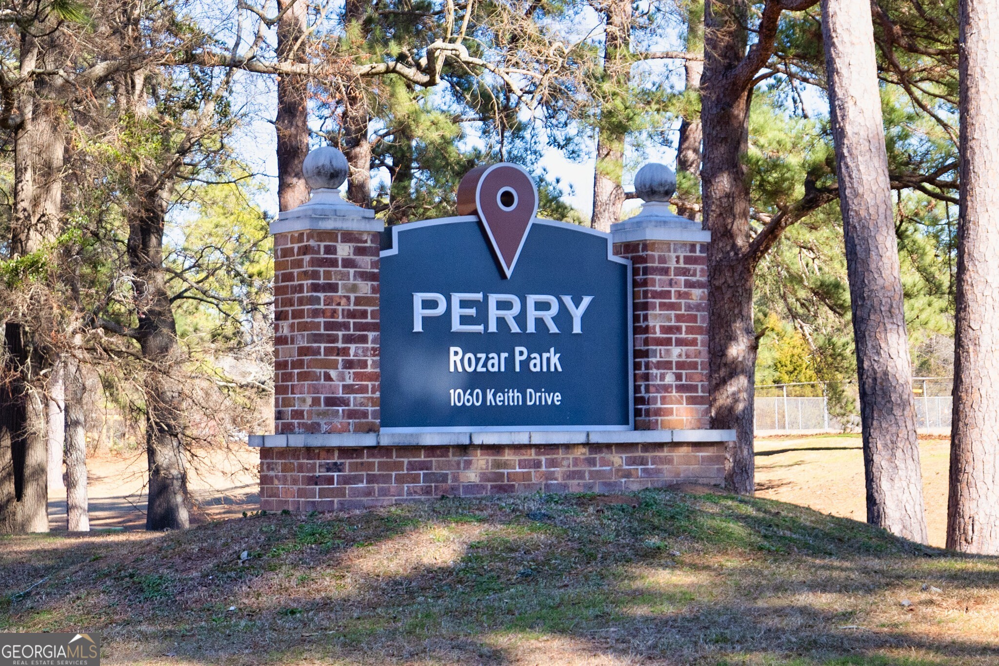 115 Bramblewood Lane Perry, GA 31069 - Photo 13 of 28 a sign that is sitting on a brick wall