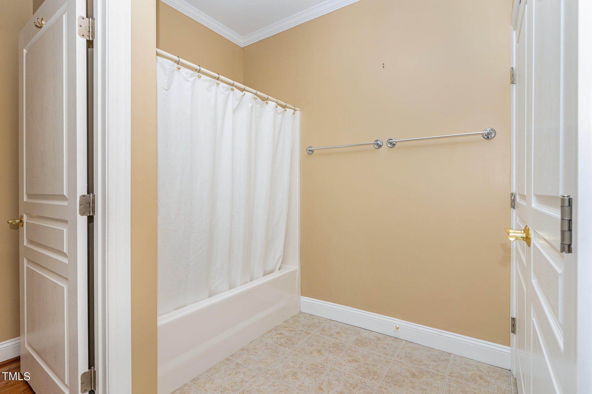 7510 Lead Mine Road, Unit 104 Raleigh, NC 27615 - Photo 18 of 23 Second/guest bath with tub/shower. Washer/dryer closet is also in here. Washer/dryer conveys!