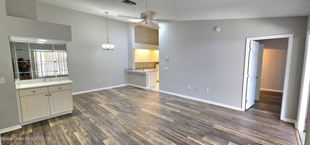 a view of a kitchen with a sink and cabinets