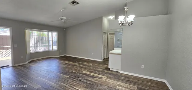a spacious bathroom with a tub and mirror