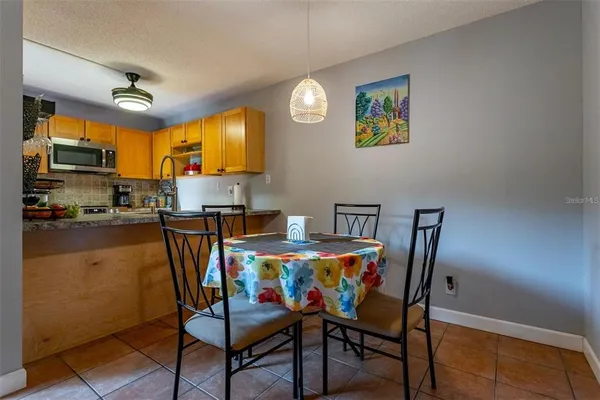 a kitchen with kitchen island granite countertop a sink appliances cabinets and a counter top space