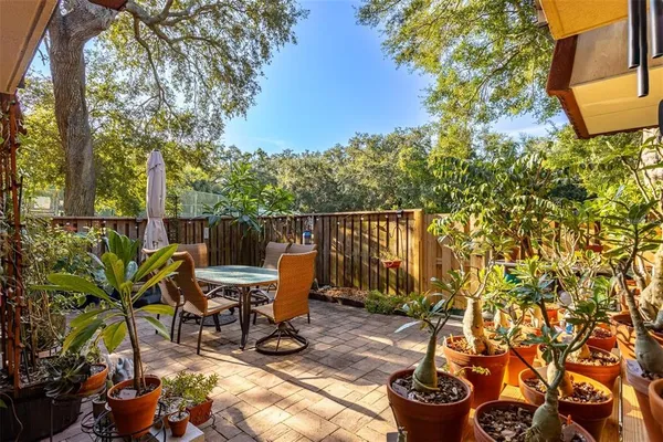 a view of a chair and table in the patio