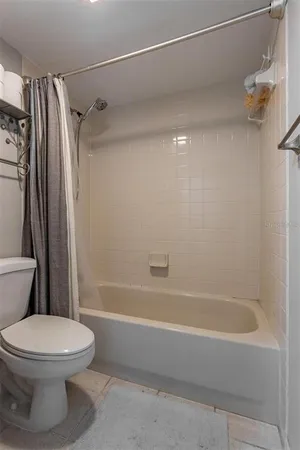 a work room with furniture wooden floor and a window