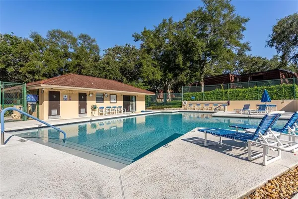 a view of swimming pool from a outdoor seating