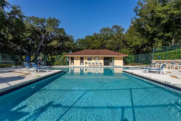 a view of house with back yard