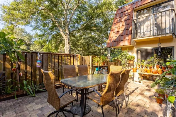 a view of a chairs and table in the patio
