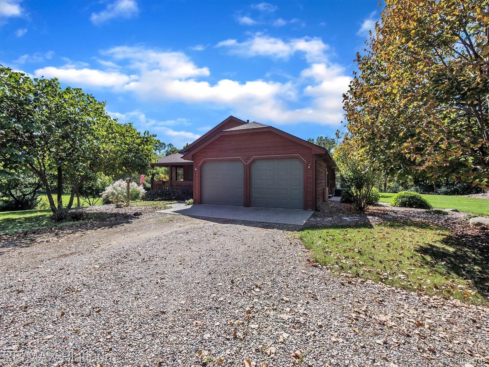 11061 Wiggins Road Howell, MI 48855 - Photo 2 of 79 SIDE ENTRY GARAGE WITH AMPLE PARKING