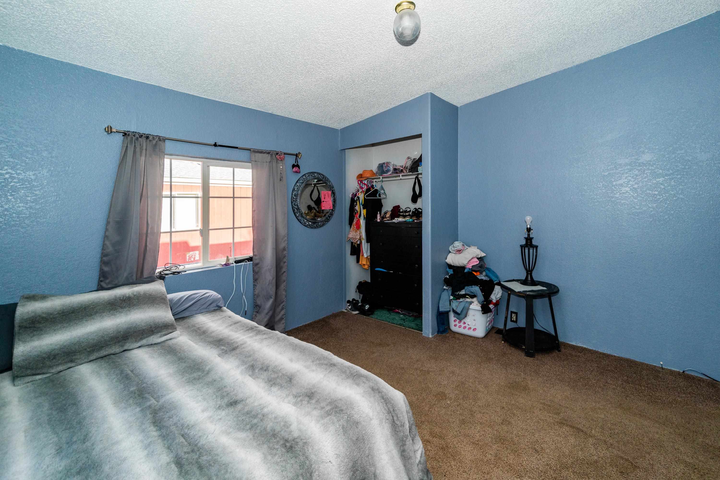 424 32 Road, Unit 265 Clifton, CO 81520 - Photo 13 of 21 a bed room with a bed and a window