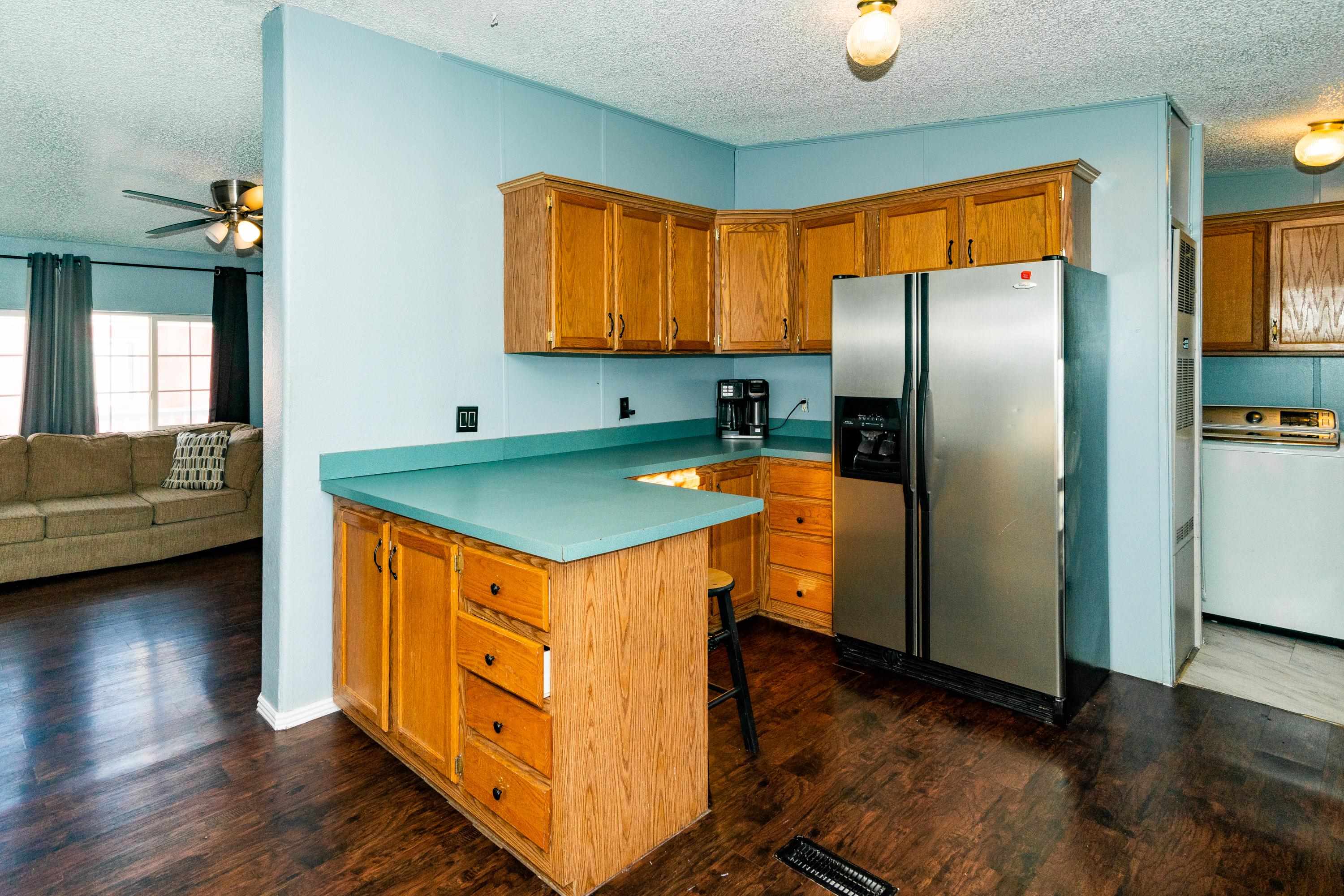 424 32 Road, Unit 265 Clifton, CO 81520 - Photo 6 of 21 a kitchen with stainless steel appliances granite countertop a refrigerator a stove and a sink