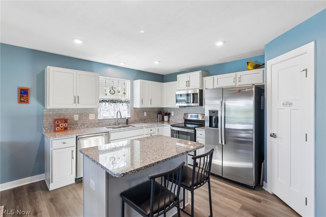 3797 Willow Way Perry, OH 44081 - Photo 2 of 44 Lovely functional kitchen with island and pantry