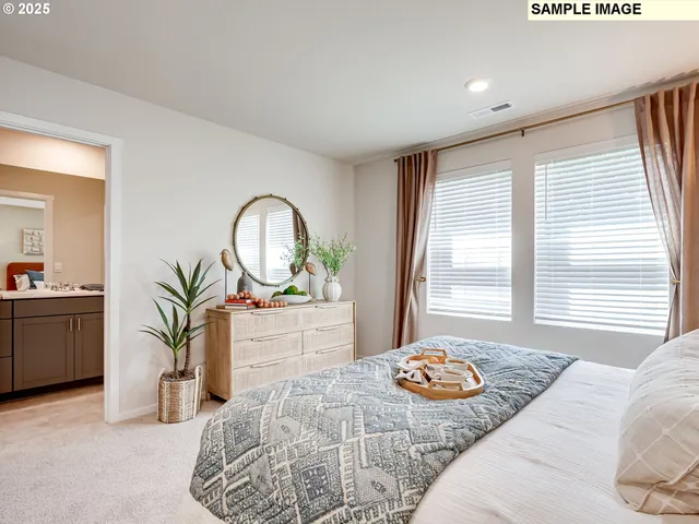 a bedroom with bed and a window